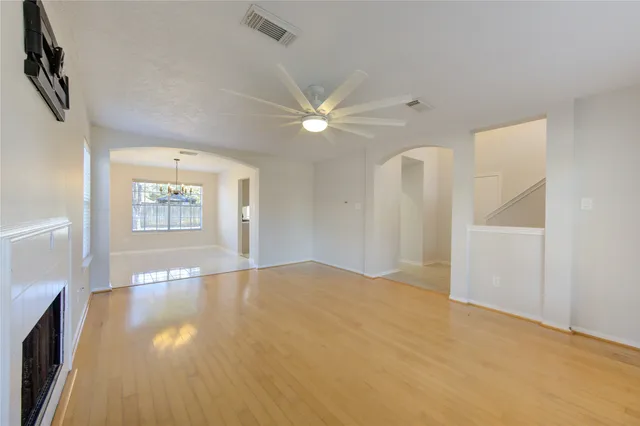 wooden floor in an empty room with a window