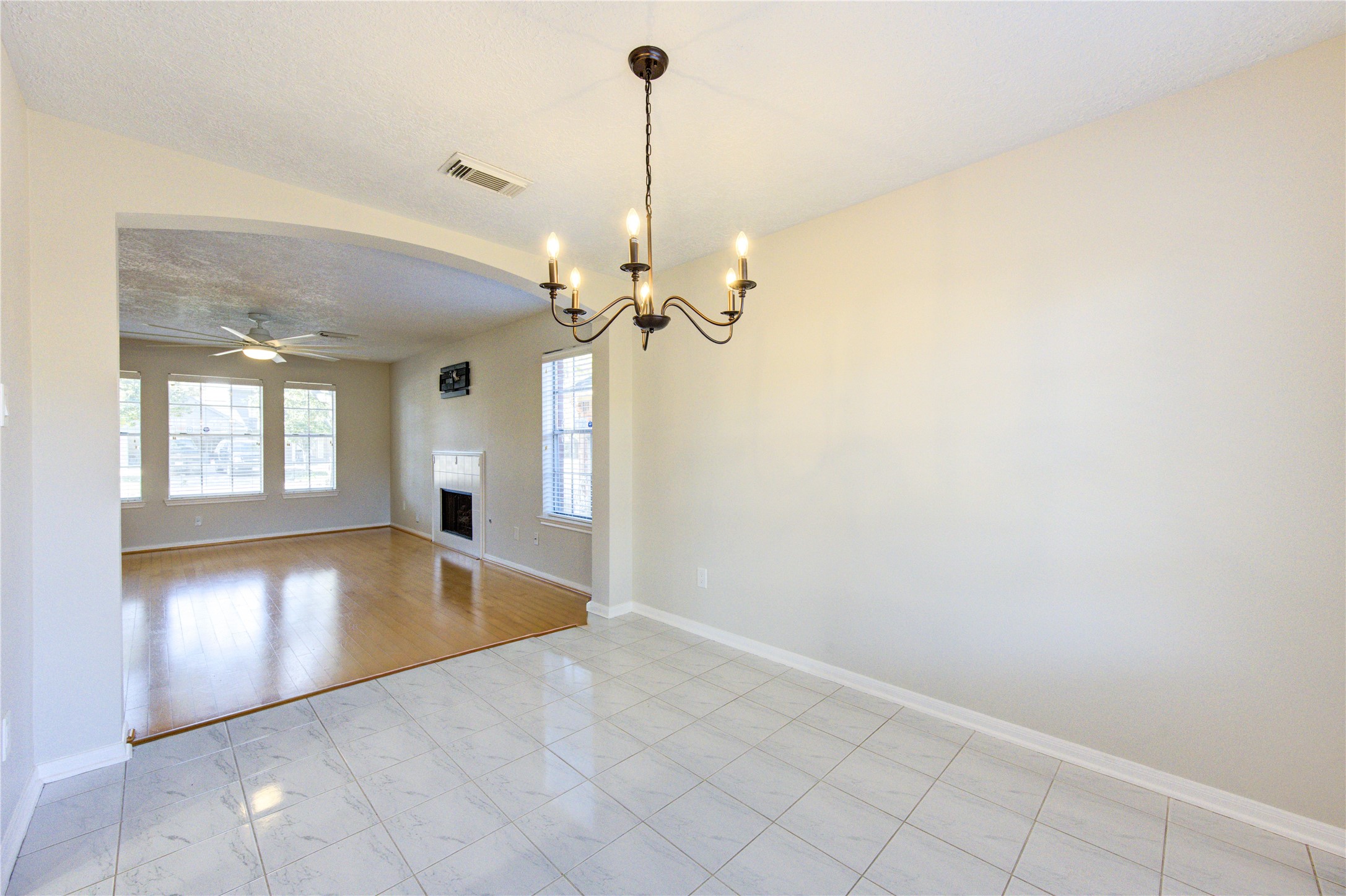 2518 Calvary Lane Katy, TX 77449 - Photo 8 of 26 a view of a livingroom with a furniture wooden floor and a chandelier