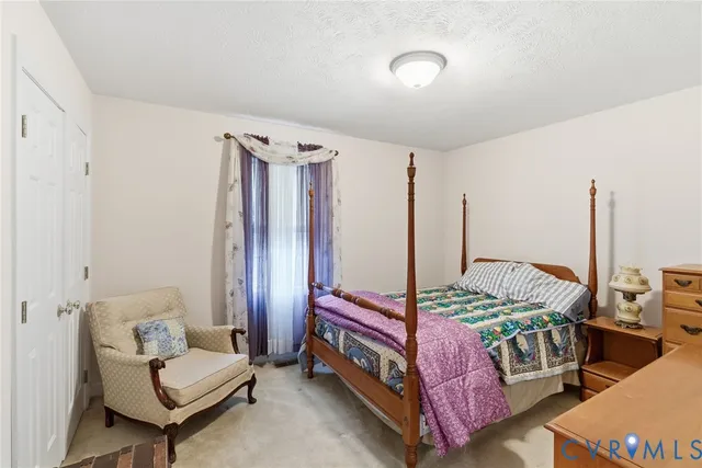 a bedroom with bed and a window