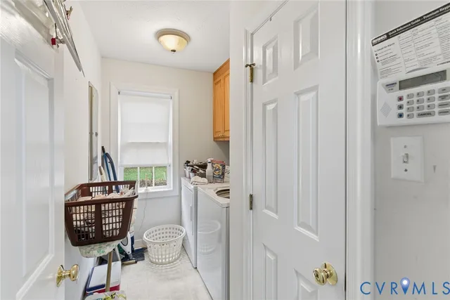 a living room with furniture a rug and a window