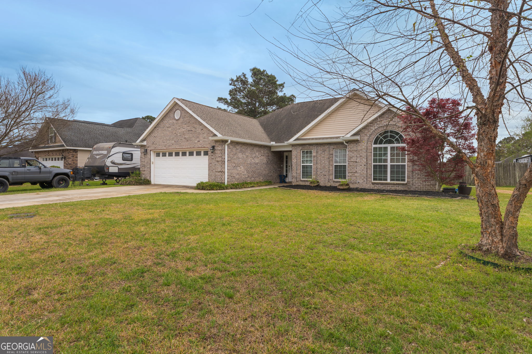 105 Galloway Street Kathleen, GA 31047 - Photo 1 of 35 a front view of house with yard and green space