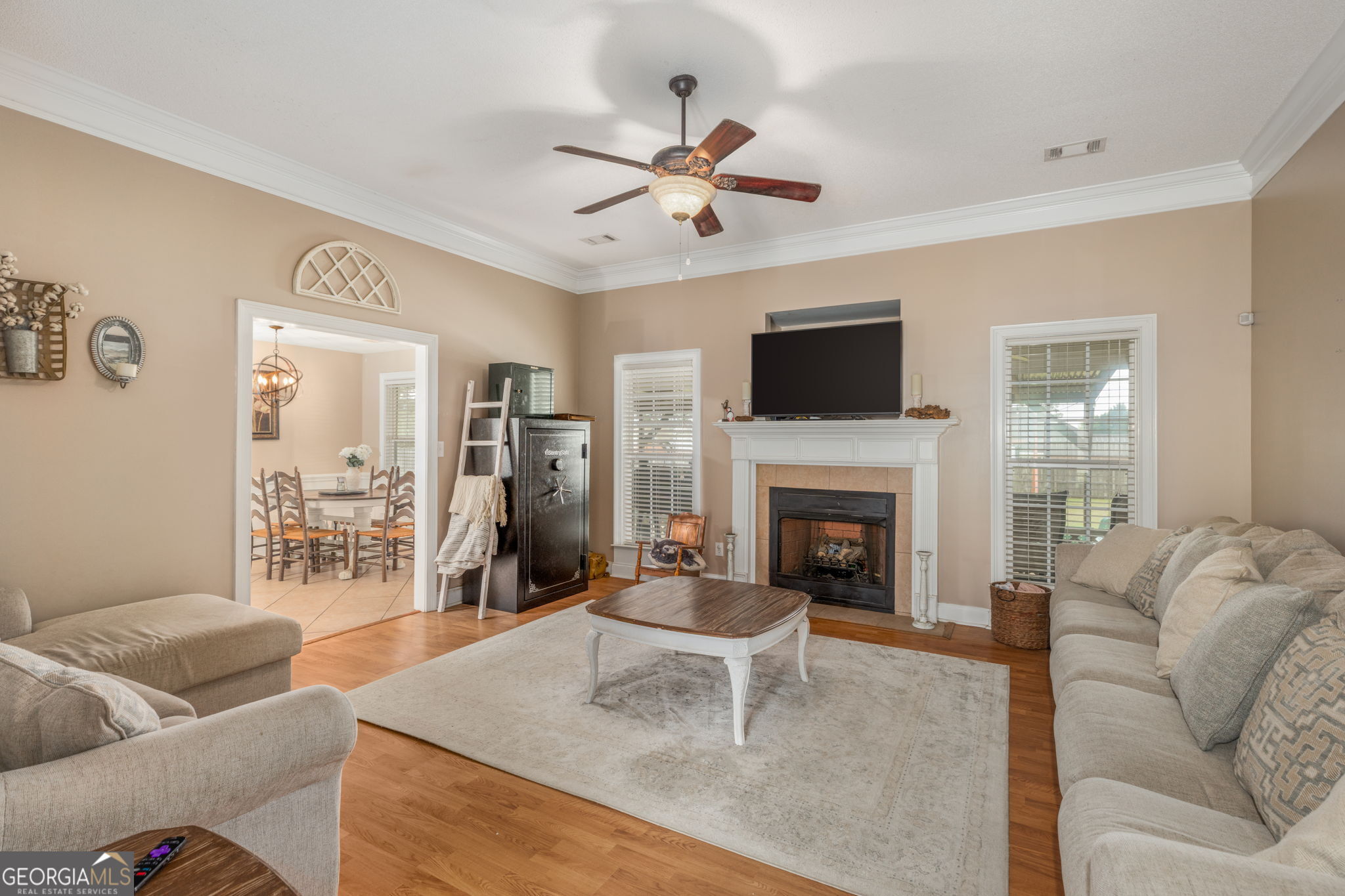 105 Galloway Street Kathleen, GA 31047 - Photo 18 of 35 a living room with furniture a fireplace and a flat screen tv