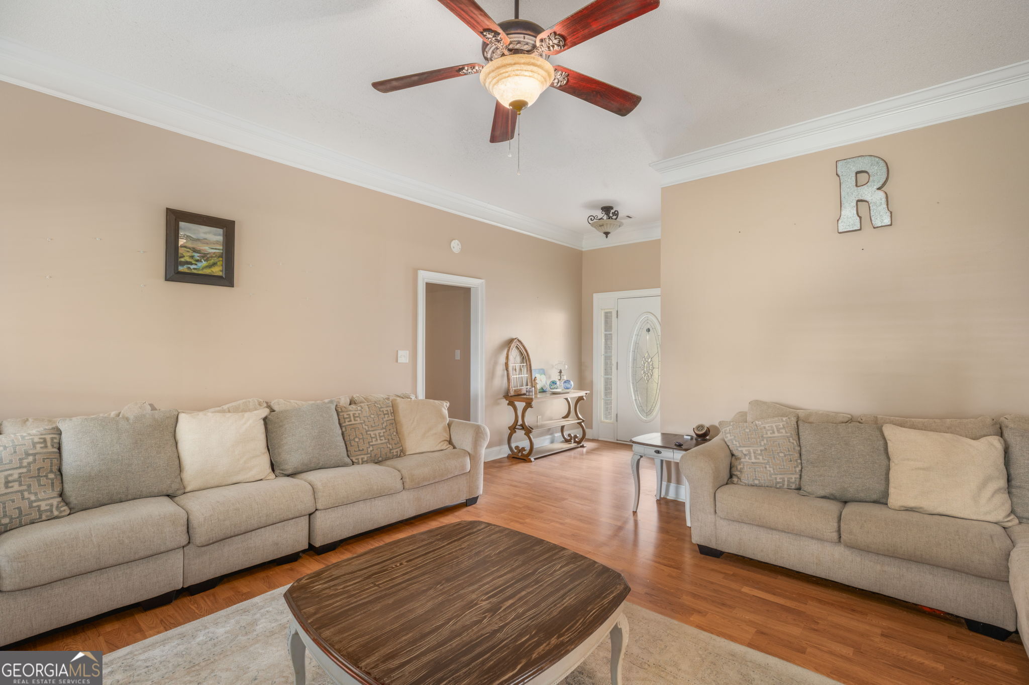 105 Galloway Street Kathleen, GA 31047 - Photo 19 of 35 a living room with furniture and a lamp