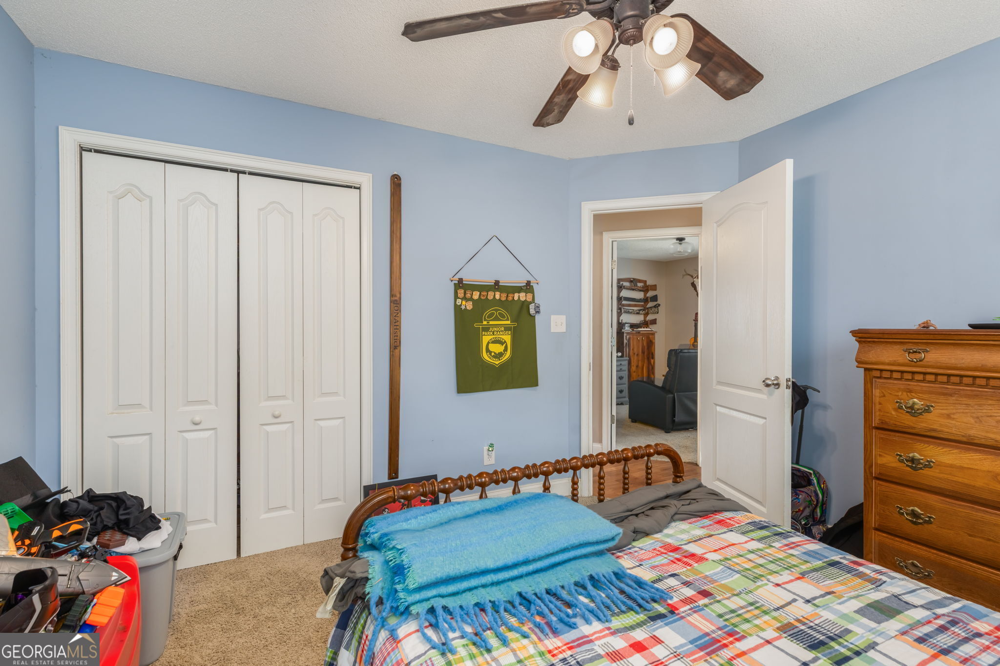 105 Galloway Street Kathleen, GA 31047 - Photo 24 of 35 a bedroom with a bed and a chandelier