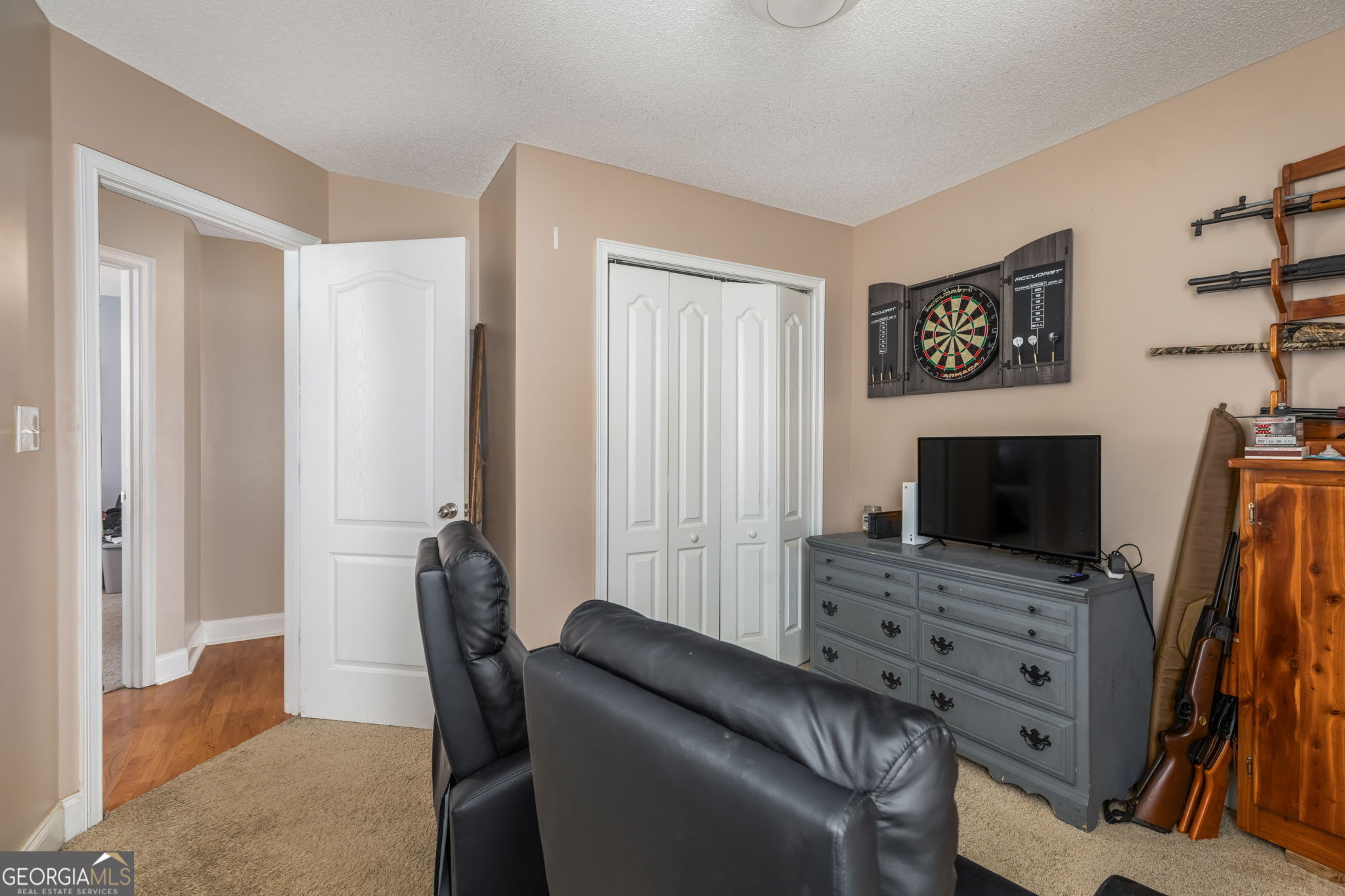 105 Galloway Street Kathleen, GA 31047 - Photo 28 of 35 a living room with furniture and a flat screen tv