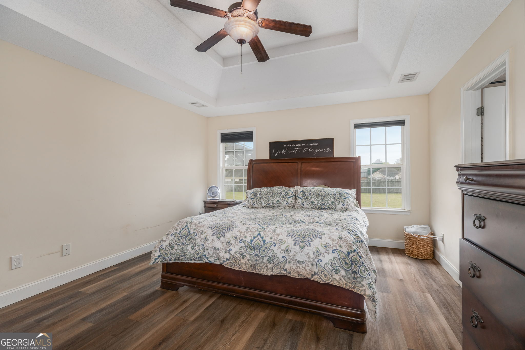 105 Galloway Street Kathleen, GA 31047 - Photo 29 of 35 a bedroom with a bed and wooden floor