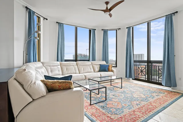 a living room with furniture and a rug