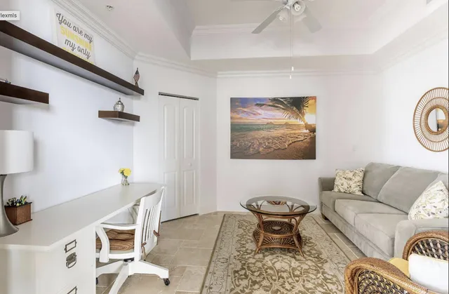 a living room with furniture a rug and a table