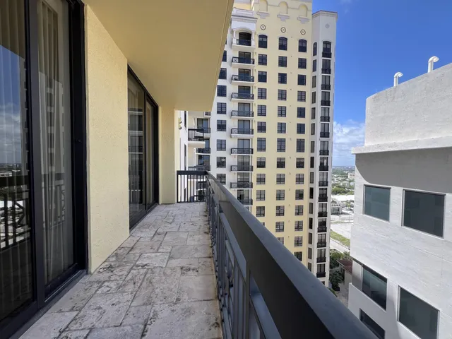 a view of a hallway with seating space