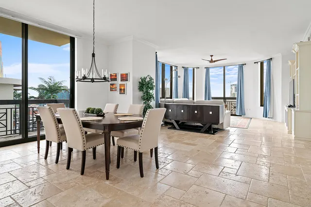 a view of a dining room with furniture window and outside view
