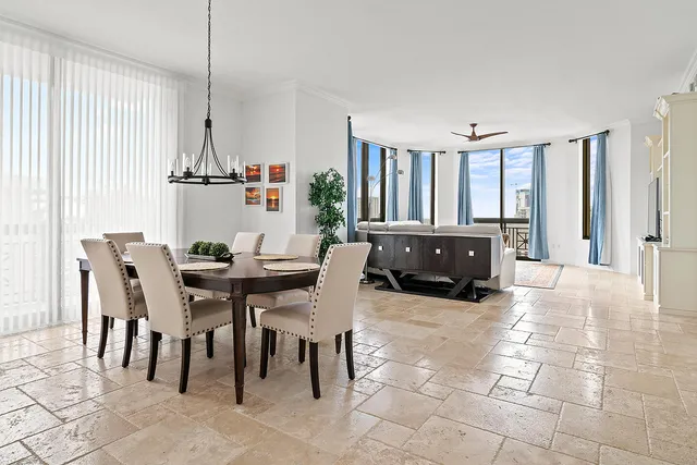 a view of a dining room with furniture window and outside view