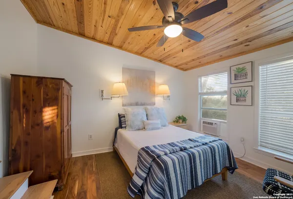 a view of sitting area with furniture and wooden floor
