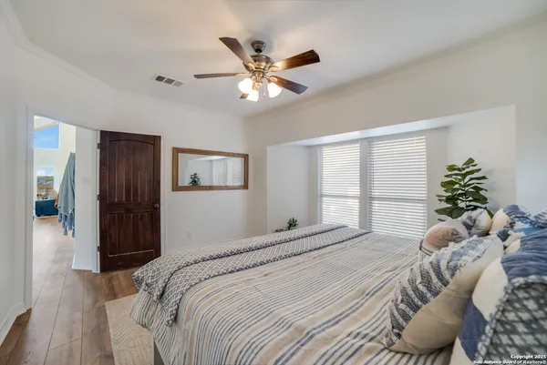 a bed room with a bed and a chandelier