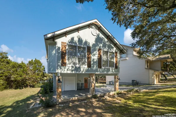 a living room with furniture a rug and a fireplace