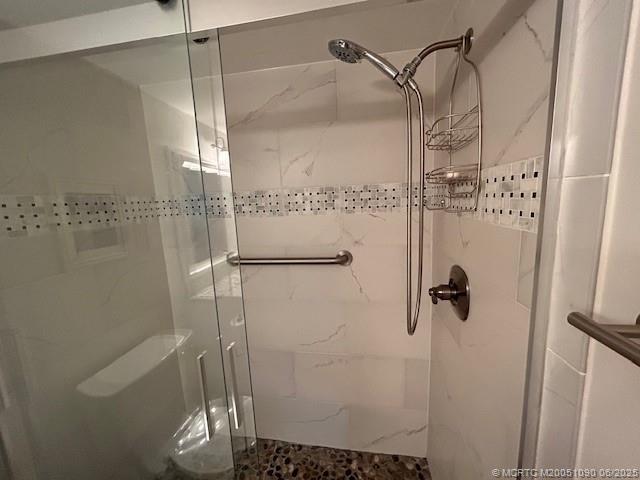 1909 Southwest Palm City Road, Unit D Stuart, FL 34994 - Photo 11 of 19 a bathroom with a shower