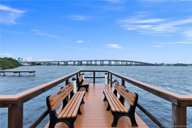 a view of a balcony with wooden floor and city view