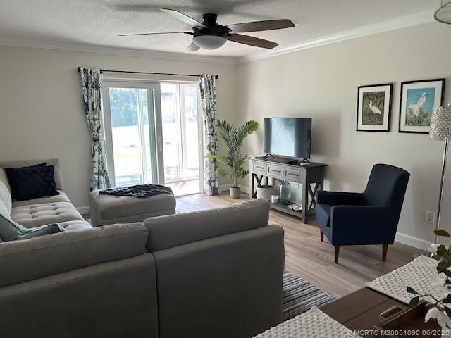 1909 Southwest Palm City Road, Unit D Stuart, FL 34994 - Photo 2 of 19 a living room with furniture and a flat screen tv
