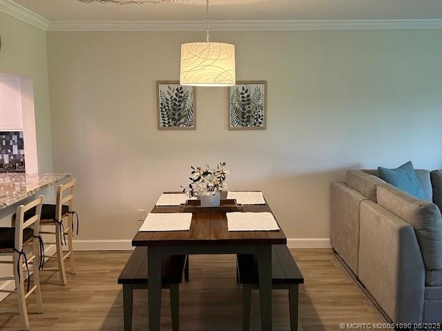 1909 Southwest Palm City Road, Unit D Stuart, FL 34994 - Photo 5 of 19 a view of a dining room with furniture and wooden floor