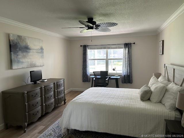 1909 Southwest Palm City Road, Unit D Stuart, FL 34994 - Photo 8 of 19 a bedroom with a bed and wooden floor