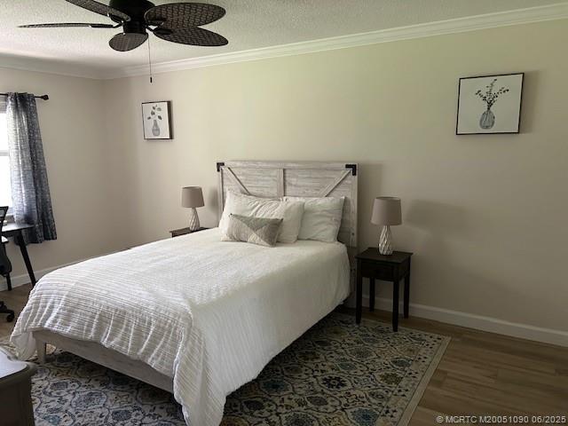 1909 Southwest Palm City Road, Unit D Stuart, FL 34994 - Photo 9 of 19 a bedroom with a bed and wooden floor