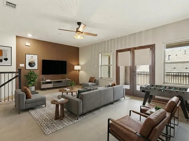 a view of empty room with ceiling fan