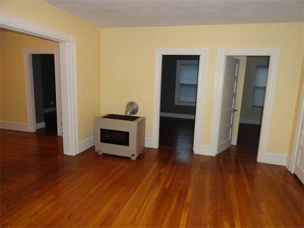 625 Stafford Road Fall River, MA 02721 - Photo 16 of 26 a view of a livingroom with wooden floor and a fireplace