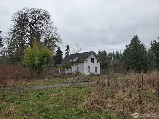 a view of a lake with trees in the background