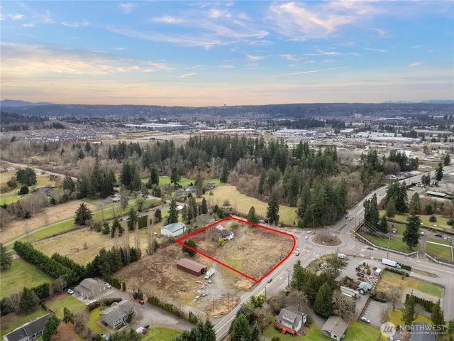 an aerial view of a house with a lake view