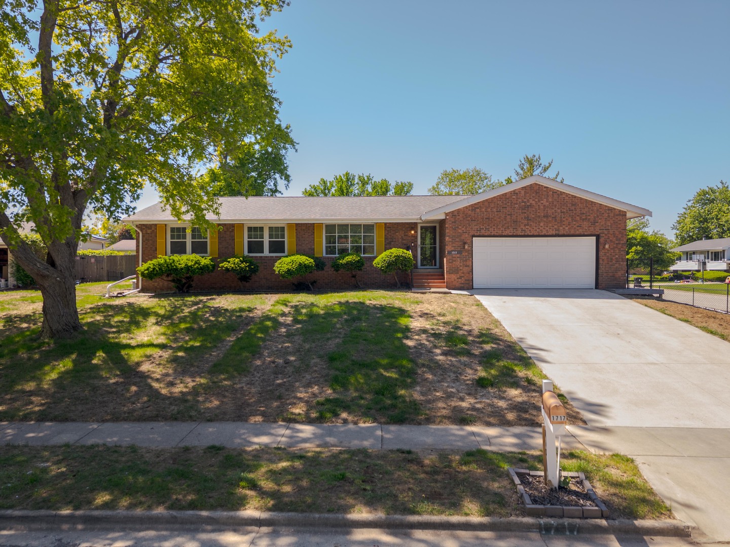 1717 Cook Drive Normal, IL 61761 - Photo 1 of 55 a front view of a house with a yard