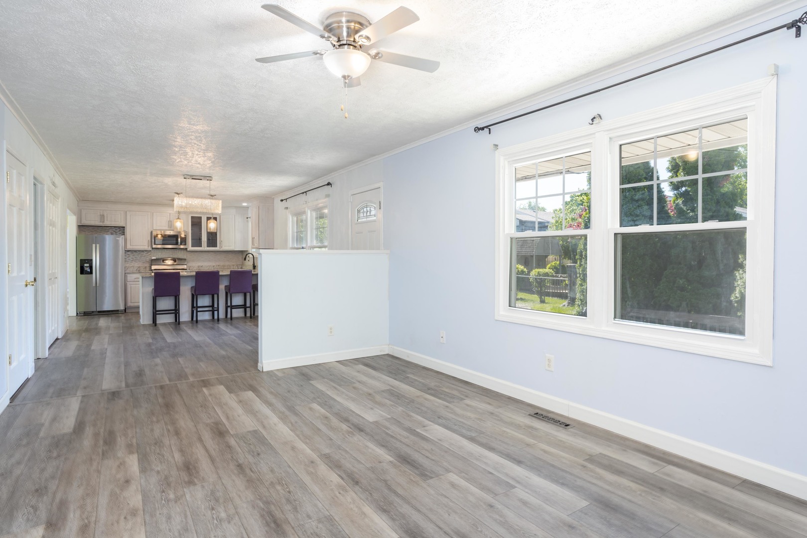 1717 Cook Drive Normal, IL 61761 - Photo 18 of 55 an empty room with wooden floor fan and windows