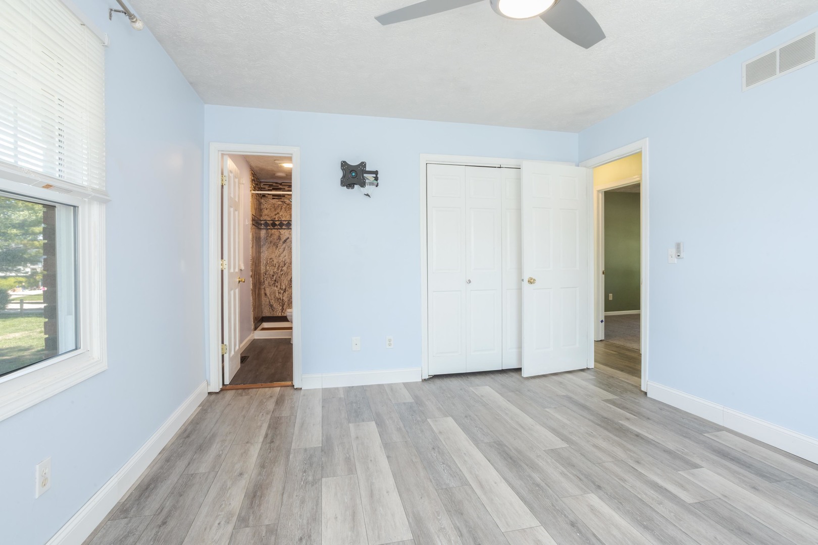 1717 Cook Drive Normal, IL 61761 - Photo 20 of 55 an empty room with wooden floor and windows