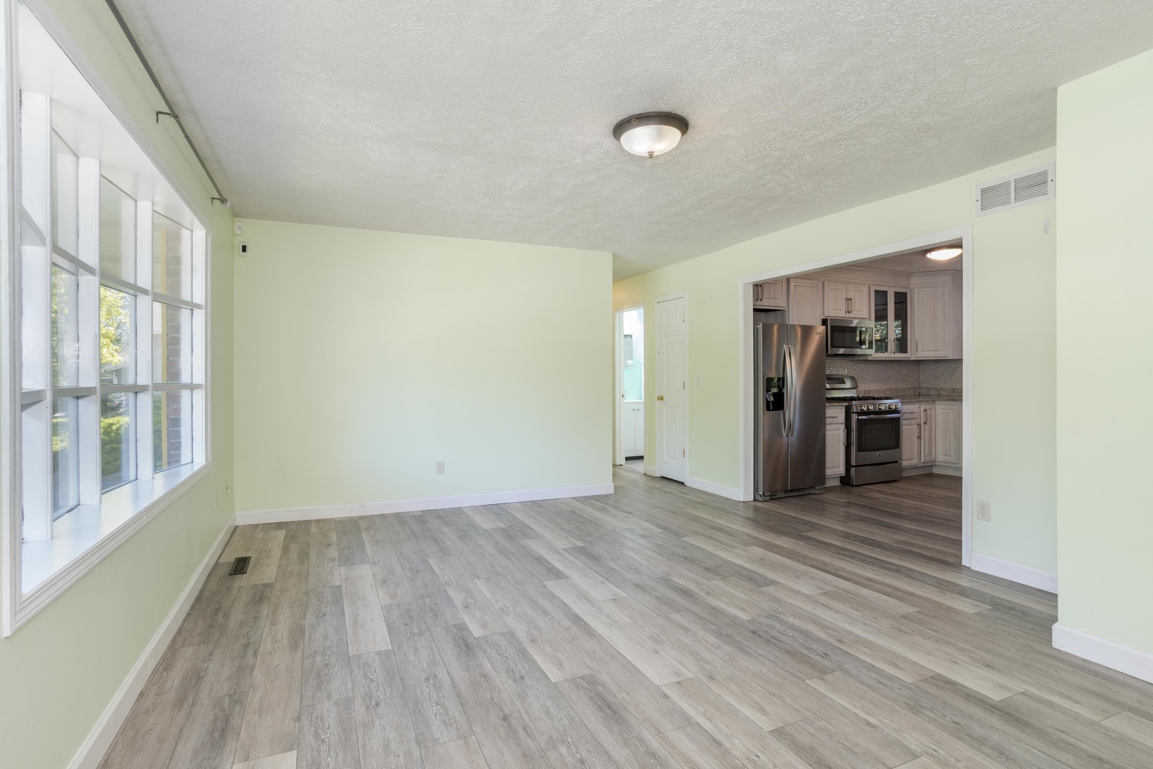 1717 Cook Drive Normal, IL 61761 - Photo 4 of 55 a view of a kitchen with wooden floor and a kitchen