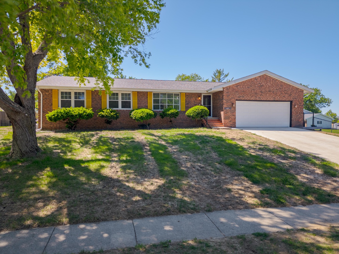 1717 Cook Drive Normal, IL 61761 - Photo 55 of 55 a front view of a house with a yard and garage