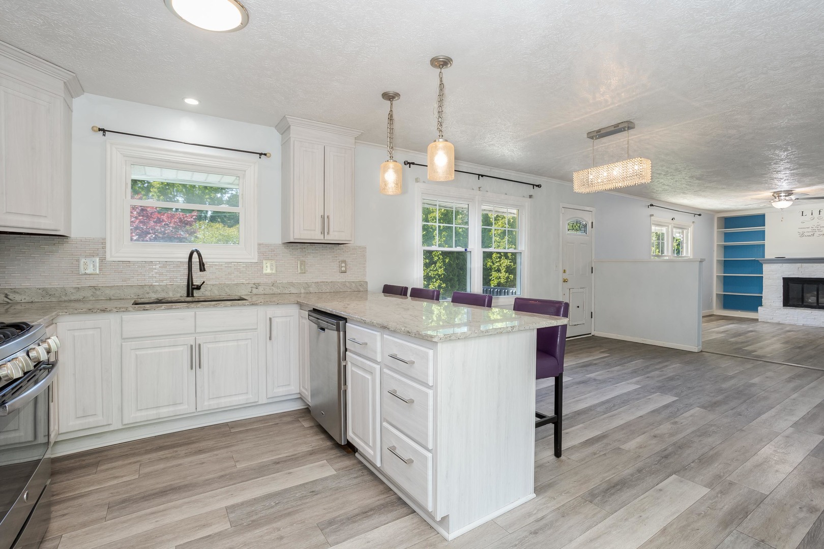 1717 Cook Drive Normal, IL 61761 - Photo 7 of 55 a kitchen that has a lot of white cabinets and wooden floor