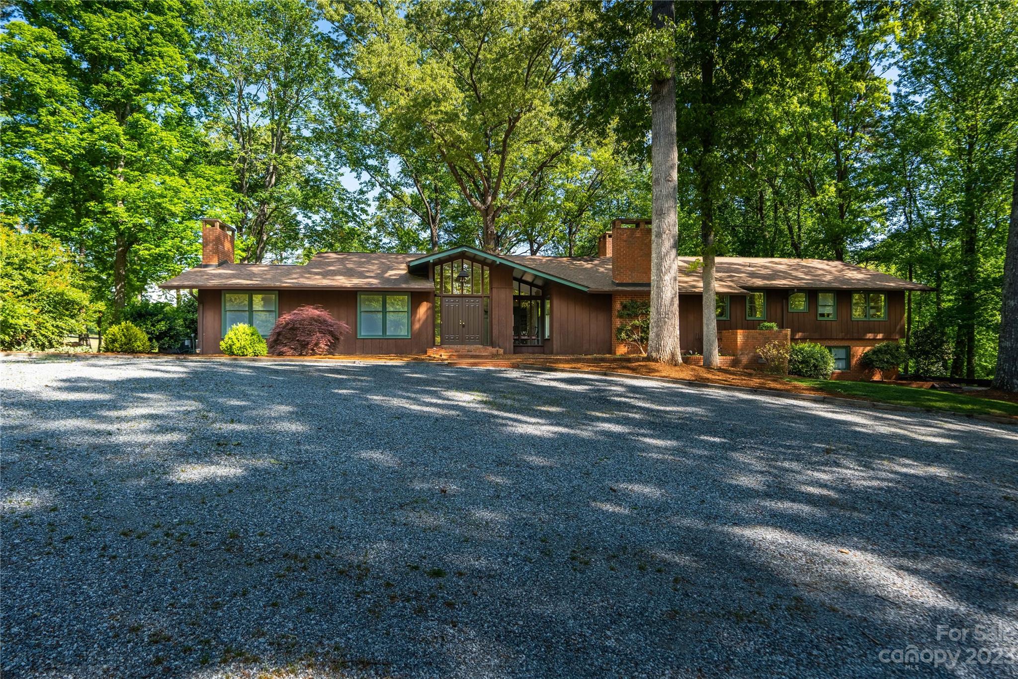 205 Hooper Creek Road Tryon, NC 28782 - Photo 1 of 45 a view of a house with a swimming pool