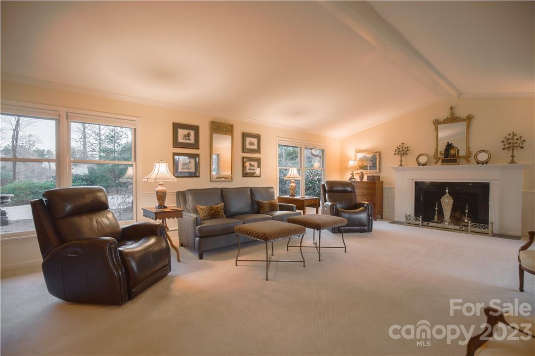205 Hooper Creek Road Tryon, NC 28782 - Photo 11 of 45 a living room with furniture large window and a fireplace