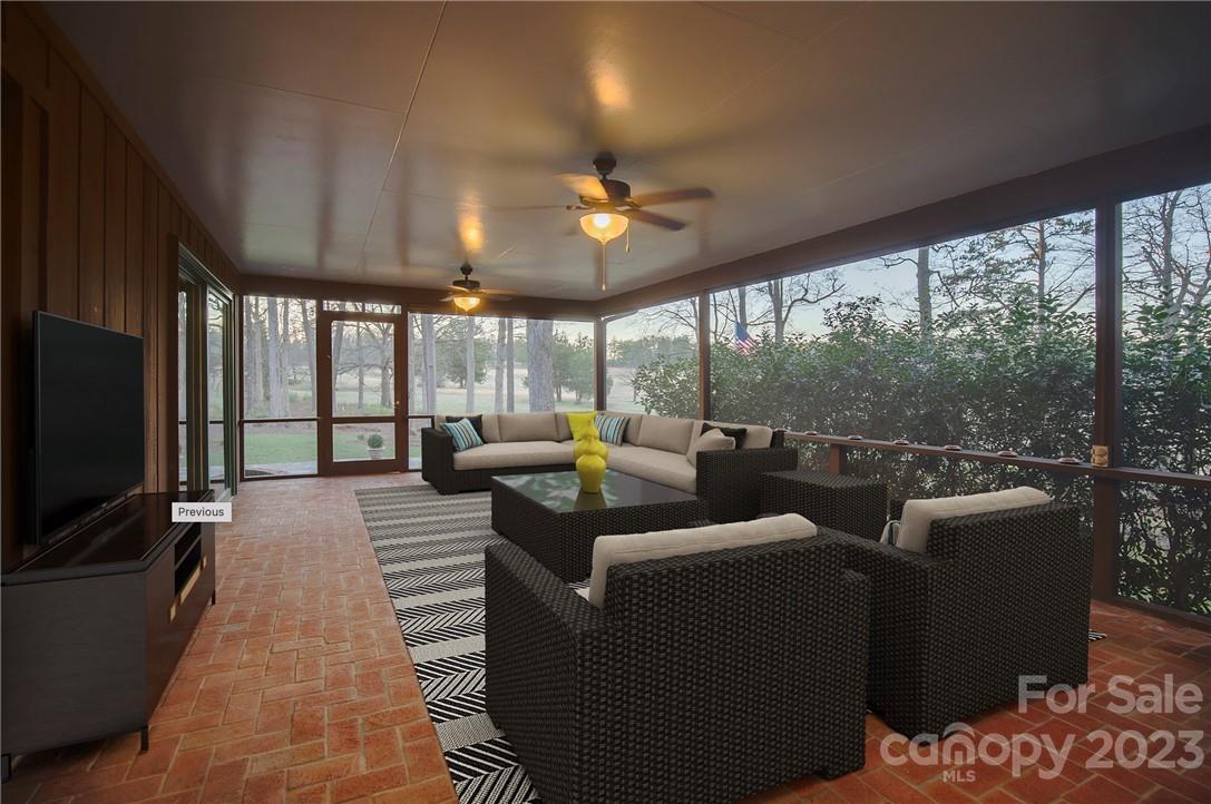 205 Hooper Creek Road Tryon, NC 28782 - Photo 23 of 45 a living room with furniture tv and a large window