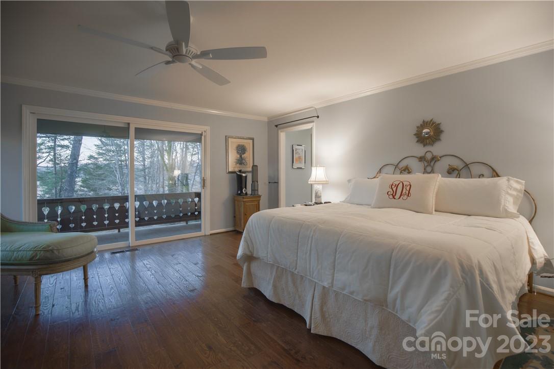 205 Hooper Creek Road Tryon, NC 28782 - Photo 29 of 45 a bedroom with a bed a table and chairs