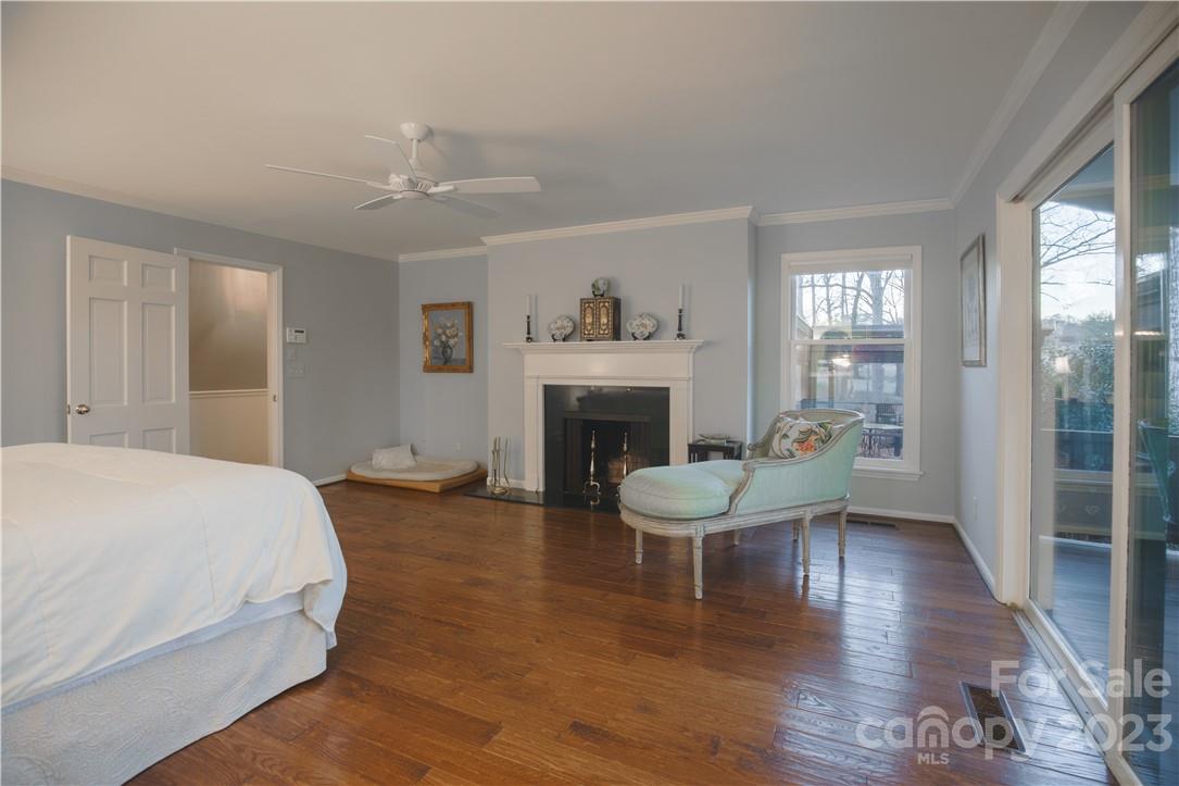 205 Hooper Creek Road Tryon, NC 28782 - Photo 30 of 45 a spacious bedroom with a bed and a fireplace
