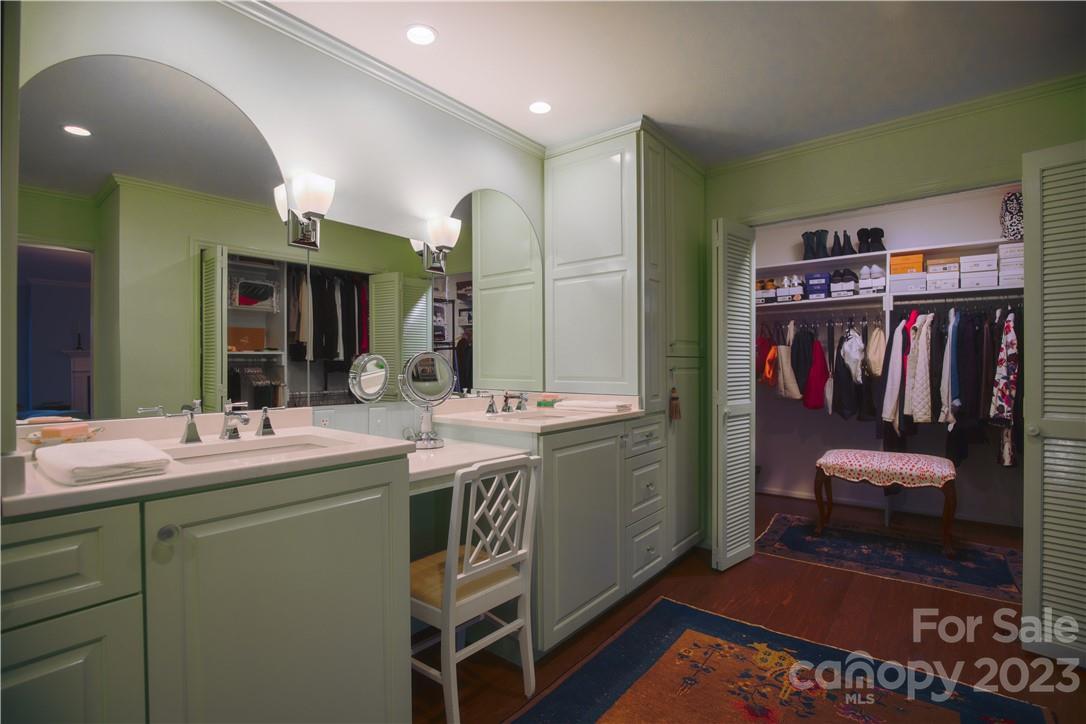 205 Hooper Creek Road Tryon, NC 28782 - Photo 32 of 45 a bathroom with a sink a vanity and a mirror