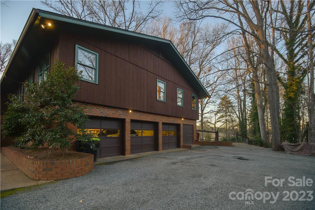 205 Hooper Creek Road Tryon, NC 28782 - Photo 4 of 45 a front view of a house with a yard