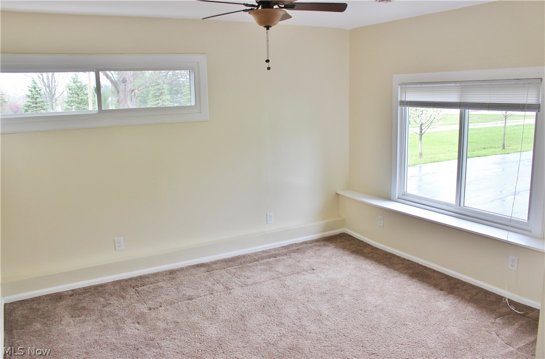 10702 Chillicothe Road Kirtland, OH 44094 - Photo 12 of 25 Family Room just painted with newer ceiling fan.