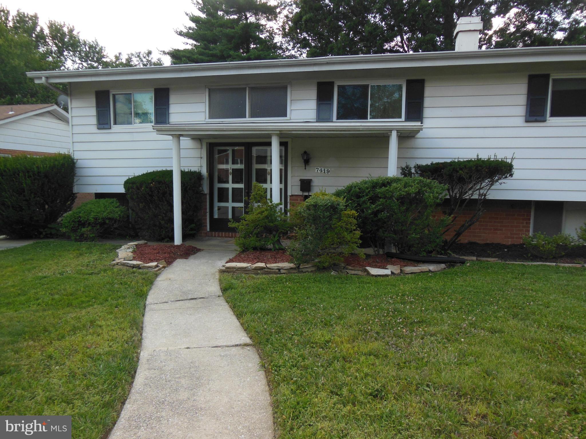 7419 Prince George Road Baltimore, MD 21208 - Photo 1 of 19 a front view of house with yard and green space