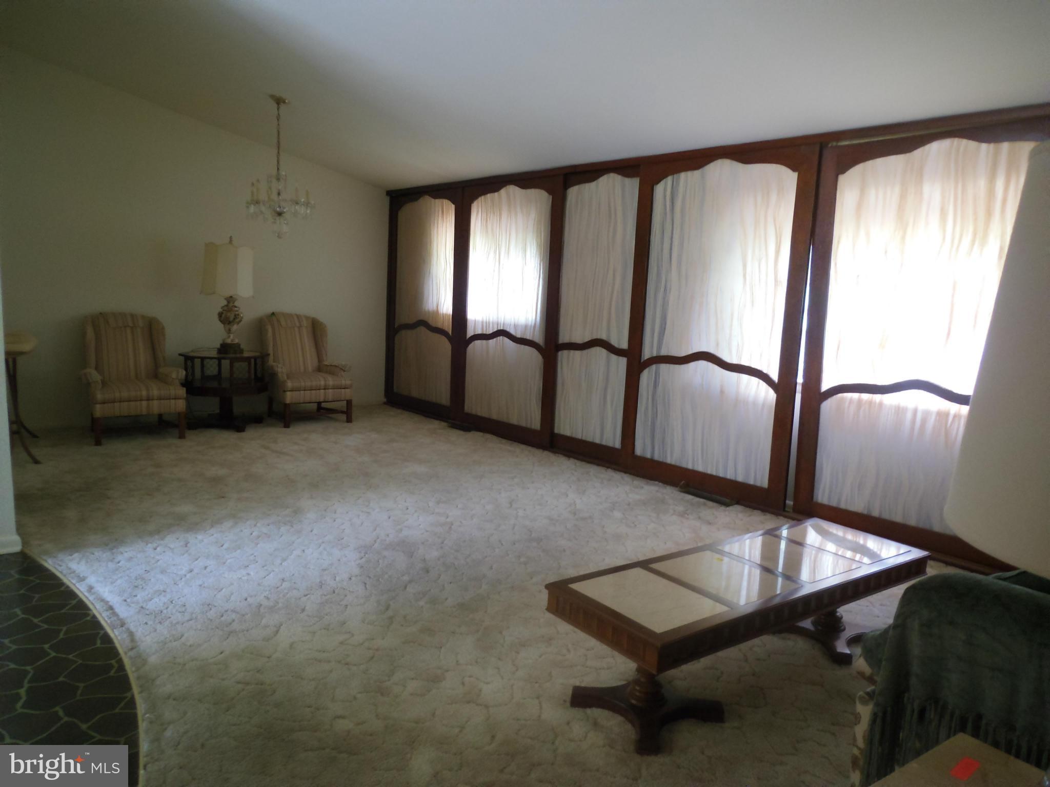 7419 Prince George Road Baltimore, MD 21208 - Photo 11 of 19 a room with gym equipment and a mirror