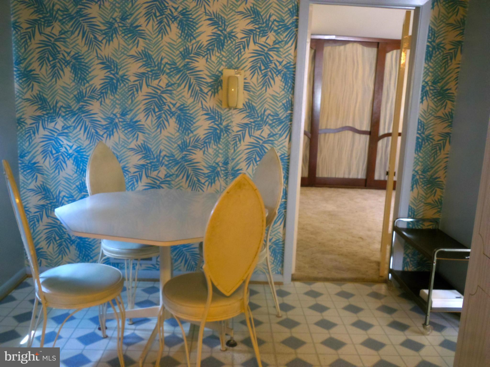 7419 Prince George Road Baltimore, MD 21208 - Photo 8 of 19 a view of a room with a table and chairs