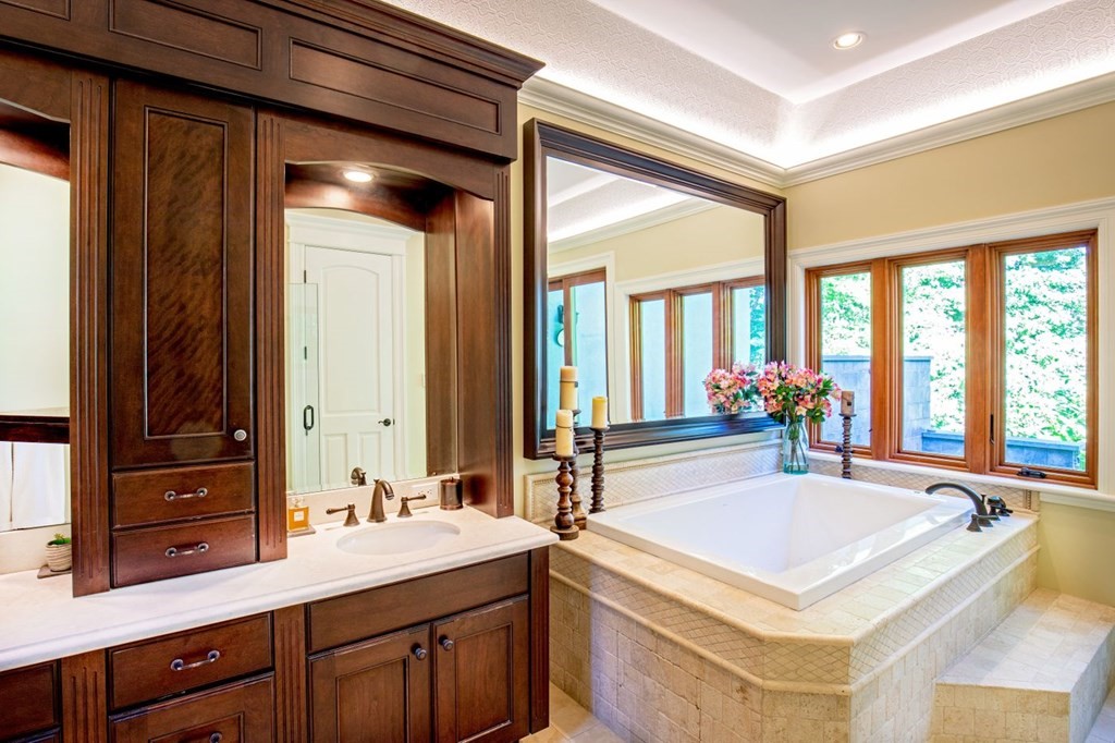 49 Wilsondale Street Dover, MA 02030 - Photo 11 of 22 a spacious bathroom with a sink and a large mirror