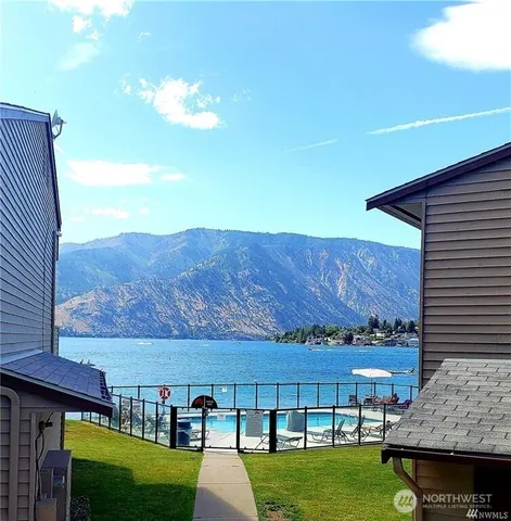 a view of a big house with a big yard