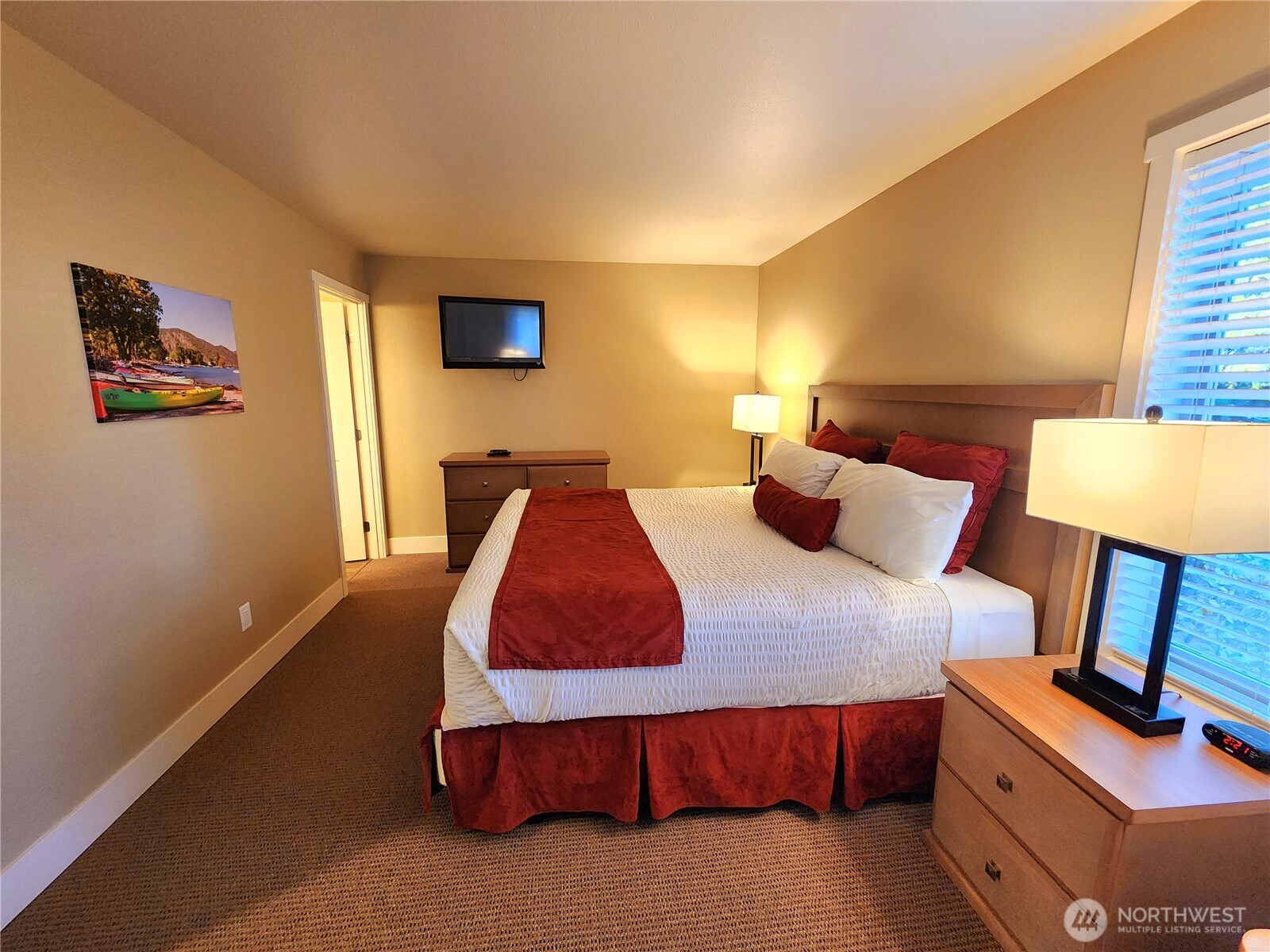 1 Lakeside 701-b Manson, WA 98831 - Photo 7 of 36 a bedroom with a bed and lamp