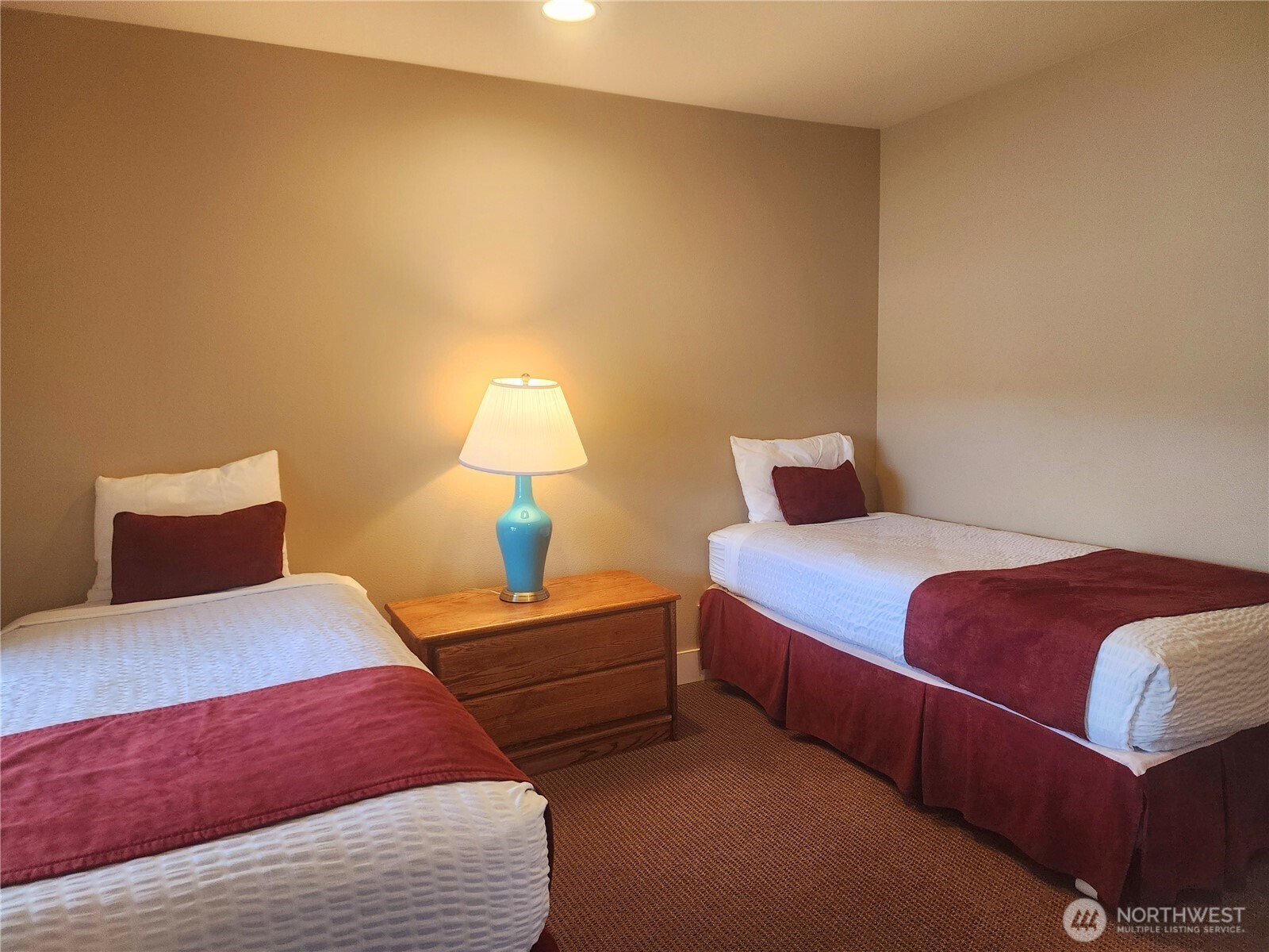 1 Lakeside 701-b Manson, WA 98831 - Photo 9 of 36 a bedroom with a bed and a lamp