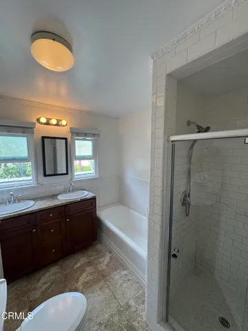 a bathroom with a sink a toilet and bathtub